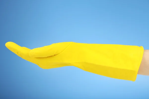 Резиновая перчатка под рукой — стоковое фото