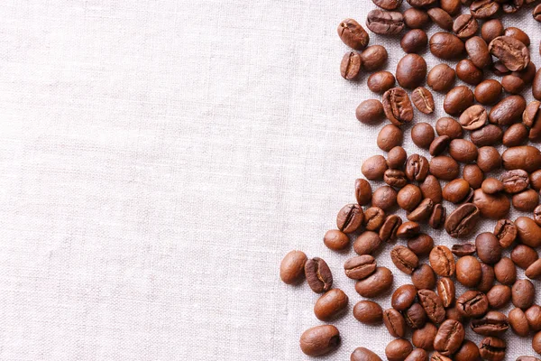 Frame of coffee beans on sackcloth background — Stock Photo, Image