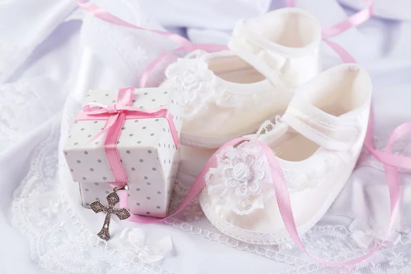 Baby shoe and cross for Christening — Stock Photo, Image