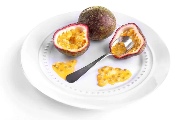 Passion fruit on plate isolated on white — Stock Photo, Image