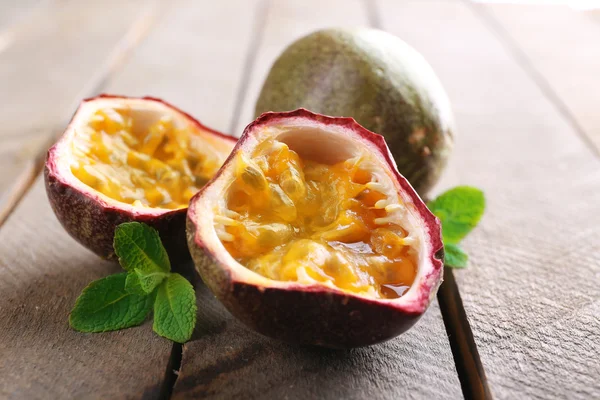 Passion fruits on wooden background — Stock Photo, Image