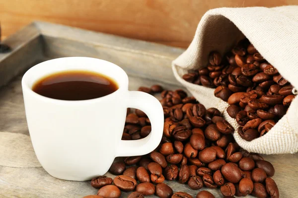 Cup of coffee with beans — Stock Photo, Image