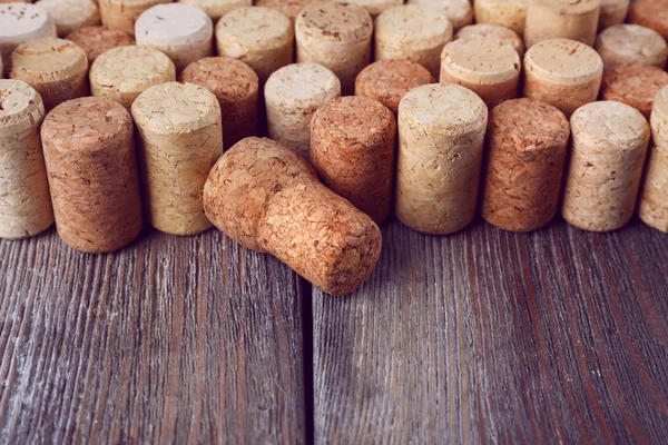 Wine corks on rustic wooden planks — Stock Photo, Image