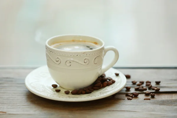 Cup of coffee on table — Stock Photo, Image