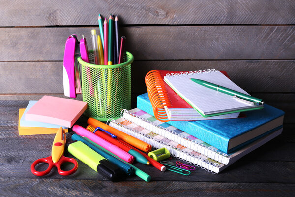 Colorful stationery on wooden background