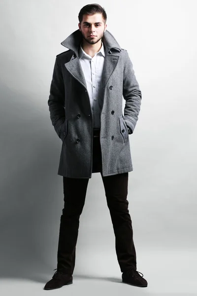 Young man in coat — Stock Photo, Image