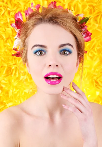 Young woman with flowers — Stock Photo, Image