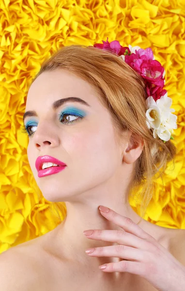 Young woman with flowers — Stock Photo, Image