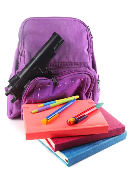 Arma na mochila da escola — Fotografia de Stock
