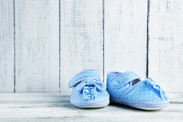 Pink toddler shoes on wooden background — Stock Photo, Image