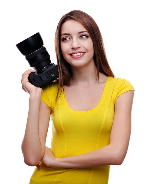 Young female photographer taking photos isolated on white