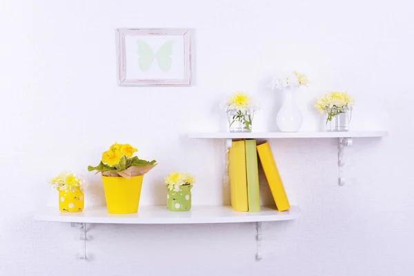 Flower on shelves on white wall background — Stock Photo, Image