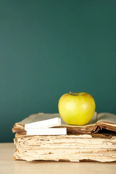 Old books, apple and chalk — Stock Photo, Image