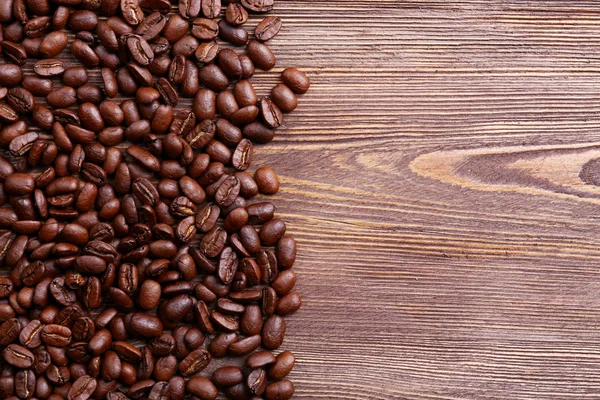 Coffee beans on wooden background — Stock Photo, Image