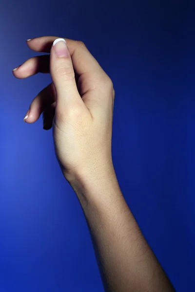 Female hand on colorful background — Stock Photo, Image