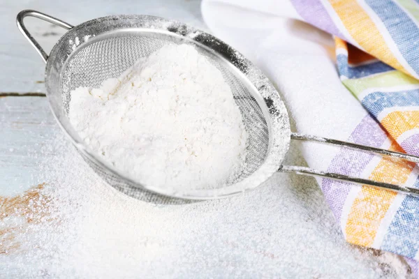 Sifting flour through sieve — Stock Photo, Image