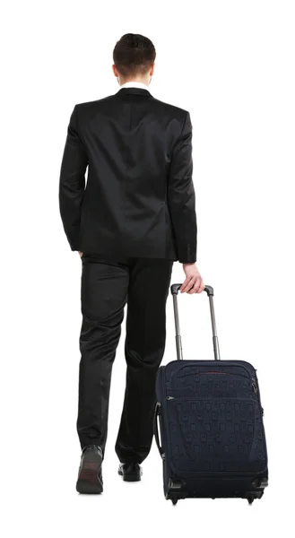 Elegante uomo in completo con valigia isolata su bianco — Foto Stock
