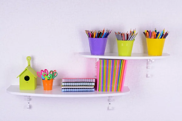 Shelves with stationery in child room close-up — Stock Photo, Image
