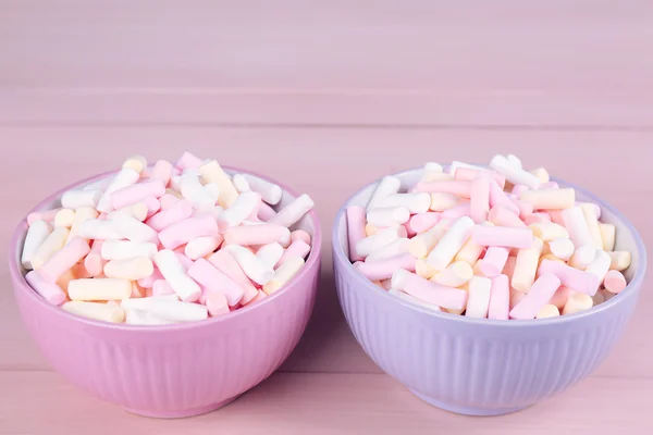 Sweet candies on color wooden background — Stock Photo, Image