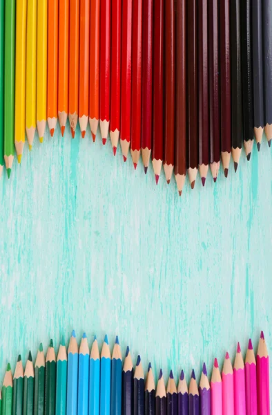 Colorful pencils on wooden table — Stock Photo, Image