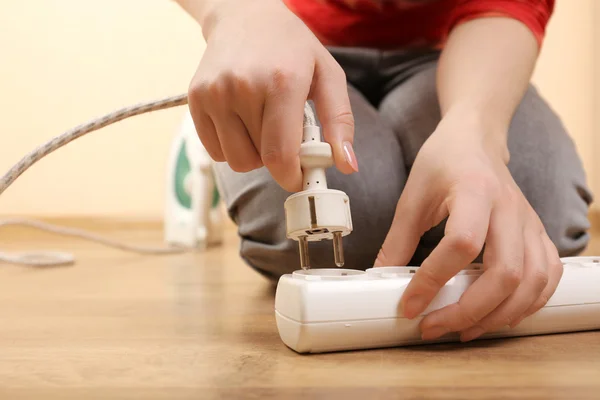 Hand putting plug in extension cord close up — Stock Photo, Image