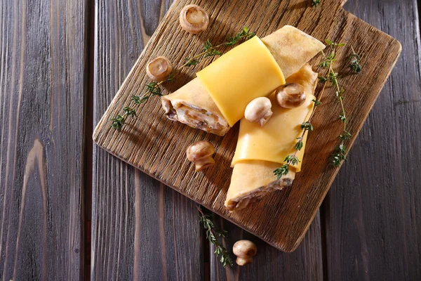 Pancakes with creamy mushrooms — Stock Photo, Image