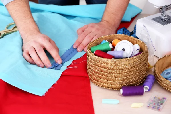 Male dressmaker tailor fabric on table — Stock Photo, Image