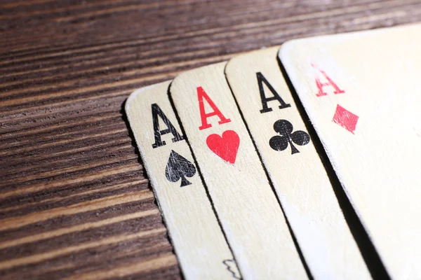 Playing cards on wooden table, closeup — Stock Photo, Image