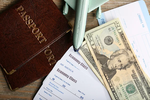 Airline tickets and documents on wooden table, closeup — Stock Photo, Image