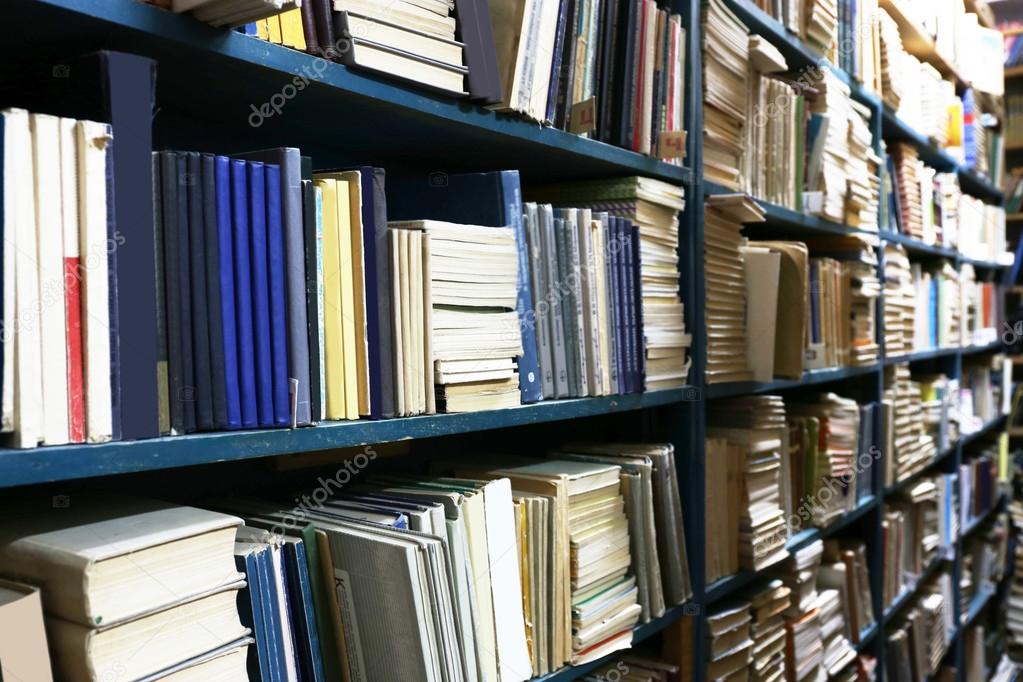 Many books on bookshelf in library