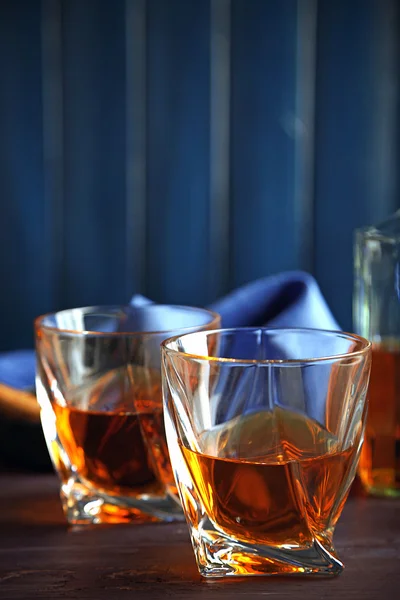 Whiskey on wooden background — Stock Photo, Image