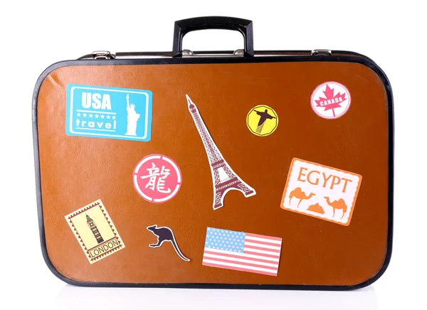 Koffer met stickers geïsoleerd op wit — Stockfoto
