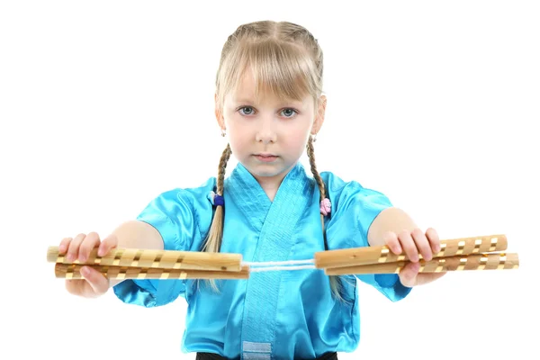 Little girl in kimono doing exercises — Stock Photo, Image