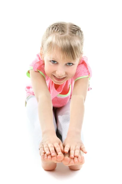 Little girl doing exercises — Stock Photo, Image