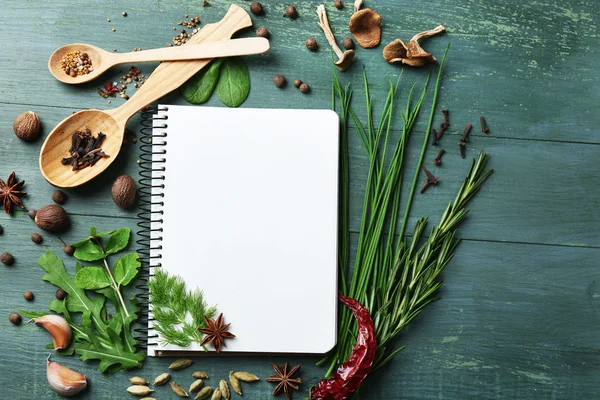 Open recipe book with fresh herbs - Stock Image - Everypixel