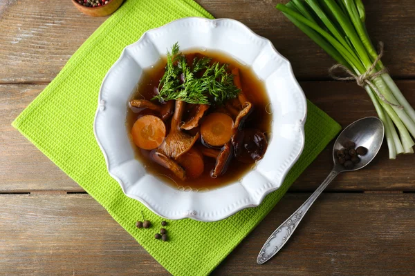 Mushroom soup on wooden table, top view — Stock Image Mushroom soup on wooden table, top view Royalty Free Stock Photos