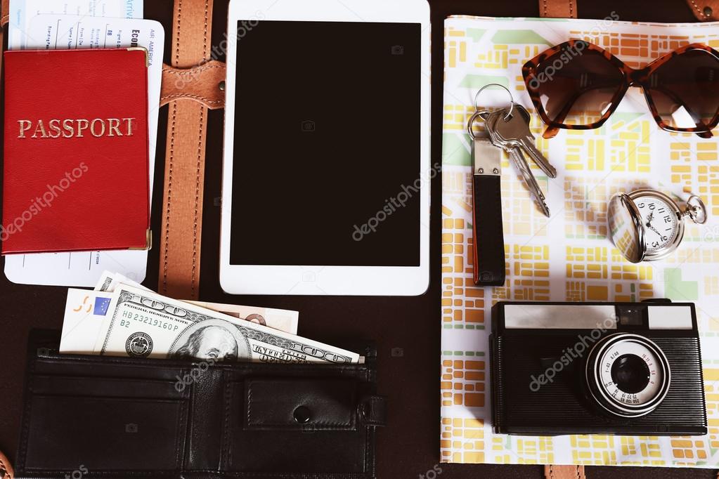 Packed suitcase of vacation items