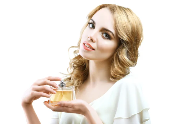 Beautiful young woman with perfume bottle isolate on white — Stock Photo, Image