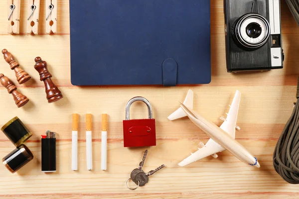 Travel gear on wooden table, top view — Stock Photo, Image