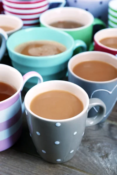 Cups of cappuccino on wooden table, closeup — Stock Photo, Image