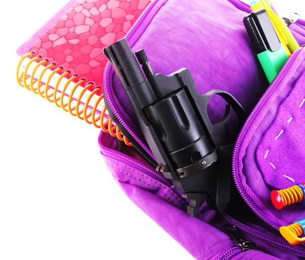 Gun in school backpack — Stock Photo, Image