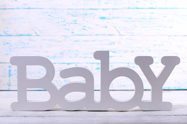 Word baby on wooden background — Stock Photo, Image