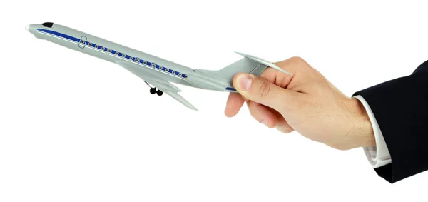 Businessman holding airplane model in hand isolated on white — Stock Photo, Image