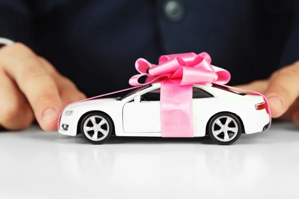 Man holding model of car in his hands — Stock Photo, Image