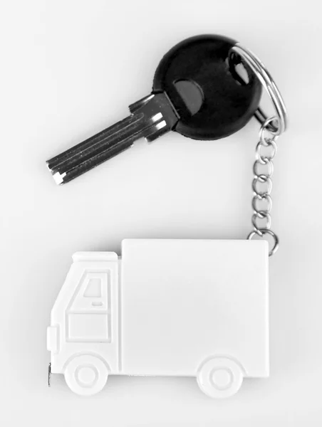 Keys with trinket on light background — Stock Photo, Image