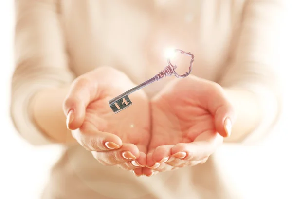 Female hands with key — Stock Photo, Image