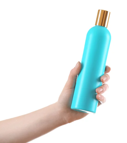 Mano femenina con botella de cosméticos aislada en blanco — Foto de Stock