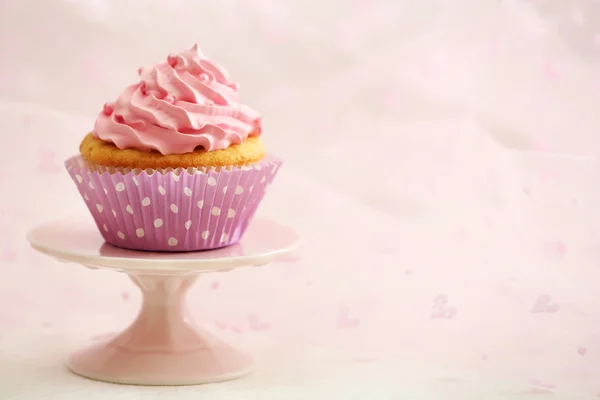 Sweet cupcake on table on light background — Stock Photo, Image