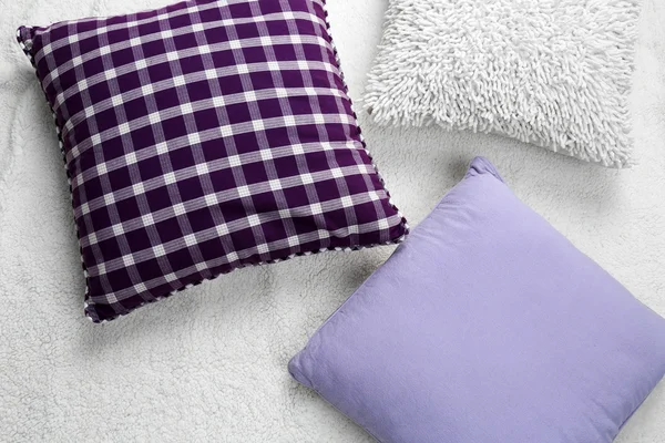 Decorative pillows on plaid close up — Stock Photo, Image