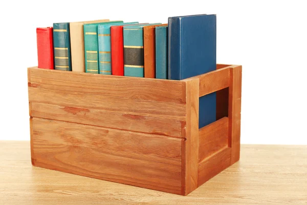Libros en caja de madera aislados en blanco —  Fotos de Stock